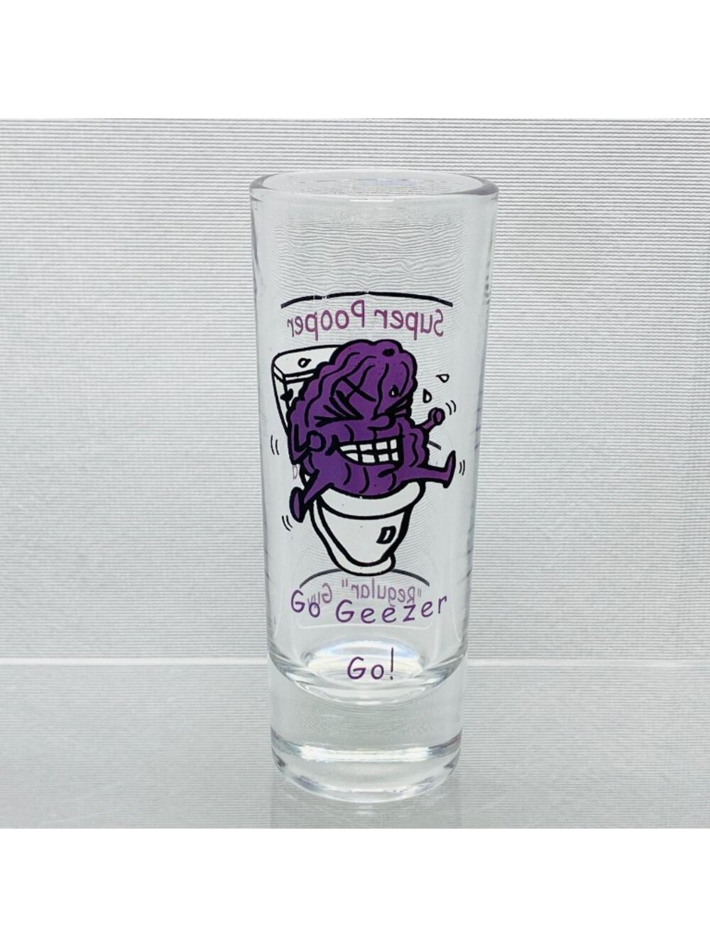 Super Pooper Shot Glass With Purple Prune Cartoon  Funny "Go Geezer Go!" Theme
